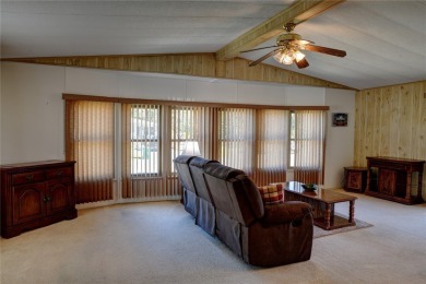This home sits on a corner lot near our 18-hole golf course. It on Barefoot Bay Golf Course in Florida - for sale on GolfHomes.com, golf home, golf lot