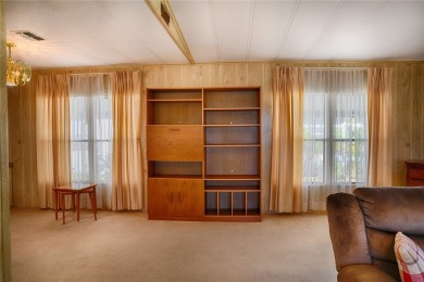 This home sits on a corner lot near our 18-hole golf course. It on Barefoot Bay Golf Course in Florida - for sale on GolfHomes.com, golf home, golf lot