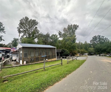 This property includes double lots that back up to one another on The Tillery Tradition Country Club in North Carolina - for sale on GolfHomes.com, golf home, golf lot