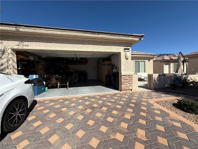 Enjoy your morning coffee from this beautiful courtyard on the on Aliante Golf Club in Nevada - for sale on GolfHomes.com, golf home, golf lot