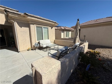 Enjoy your morning coffee from this beautiful courtyard on the on Aliante Golf Club in Nevada - for sale on GolfHomes.com, golf home, golf lot