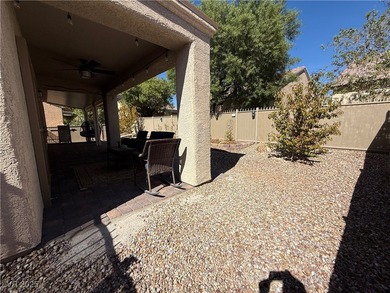 Enjoy your morning coffee from this beautiful courtyard on the on Aliante Golf Club in Nevada - for sale on GolfHomes.com, golf home, golf lot
