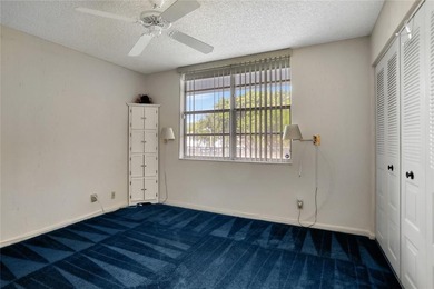 2 BR/2BA second floor residence in a well maintained 55+ on  in Florida - for sale on GolfHomes.com, golf home, golf lot