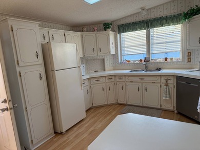 Priced to sell at $34,900, monthly lot rent is $1248 on Pine Lakes Country Club in Florida - for sale on GolfHomes.com, golf home, golf lot