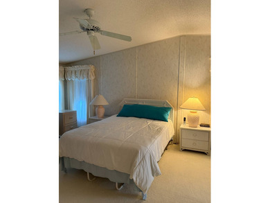 Priced to sell at $34,900, monthly lot rent is $1248 on Pine Lakes Country Club in Florida - for sale on GolfHomes.com, golf home, golf lot