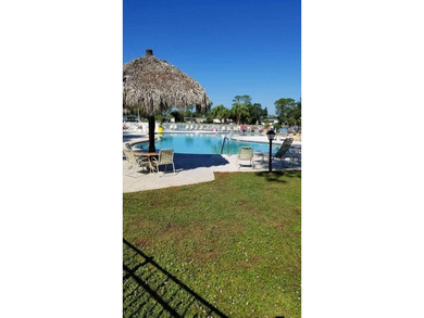 Priced to sell at $34,900, monthly lot rent is $1248 on Pine Lakes Country Club in Florida - for sale on GolfHomes.com, golf home, golf lot