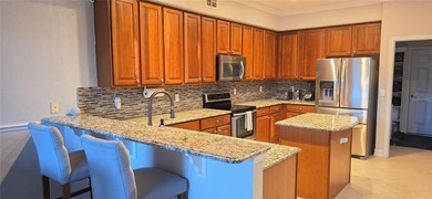 Stunning 4BD/3BA Golf Course Views in Gated North Shore at Lake on North Shore Golf Club in Florida - for sale on GolfHomes.com, golf home, golf lot