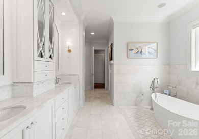 Set along the 14th hole of Trump National Golf Club Charlotte on Trump National Golf Club Charlotte in North Carolina - for sale on GolfHomes.com, golf home, golf lot