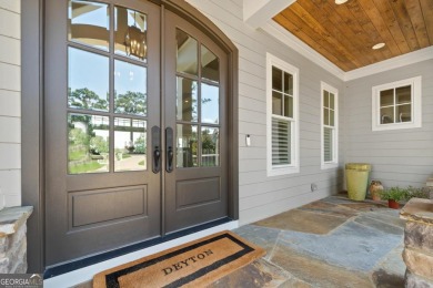 Luxury Lakefront Living. Welcome to 131 Cape View Lane, located on The Golf Club at Cuscowilla in Georgia - for sale on GolfHomes.com, golf home, golf lot
