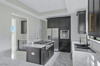 Gulf Access Lakefront Luxury Estate - New Construction 5 Bedroom on Burnt Store Golf Club in Florida - for sale on GolfHomes.com, golf home, golf lot