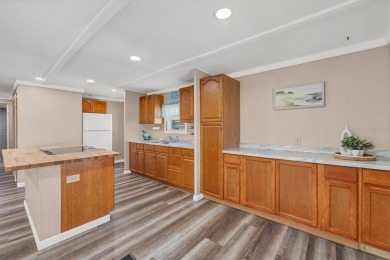 Check out this charming home where you own your own land in the on Sabal Trace Golf and Country Club in Florida - for sale on GolfHomes.com, golf home, golf lot