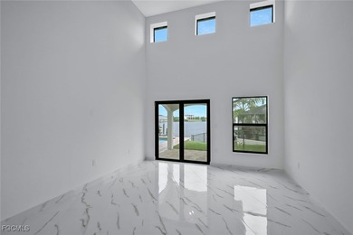 Gulf Access Lakefront Luxury Estate - New Construction 5 Bedroom on Burnt Store Golf Club in Florida - for sale on GolfHomes.com, golf home, golf lot