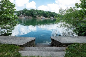 Lakefront! Loch Lomond. Concrete sea wall with steps into the on Bella Vista Country Club - Highlands in Arkansas - for sale on GolfHomes.com, golf home, golf lot