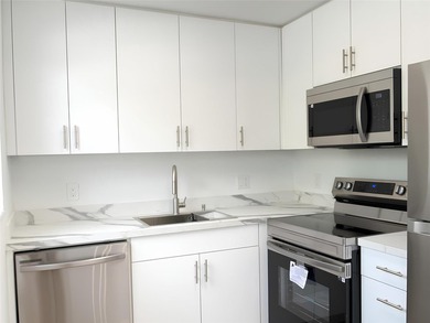 SELLER MOTIVATED. Bright & Spacious First-Floor Corner Unit! on Hillsboro Pines Golf in Florida - for sale on GolfHomes.com, golf home, golf lot