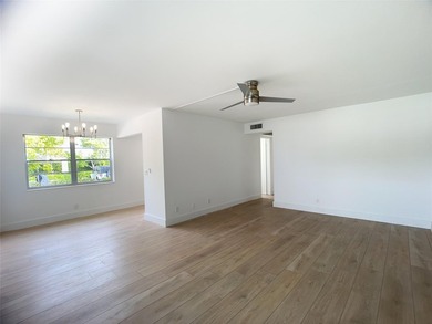 SELLER MOTIVATED. Bright & Spacious First-Floor Corner Unit! on Hillsboro Pines Golf in Florida - for sale on GolfHomes.com, golf home, golf lot