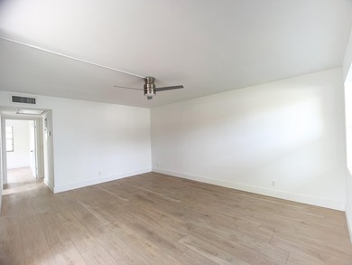 SELLER MOTIVATED. Bright & Spacious First-Floor Corner Unit! on Hillsboro Pines Golf in Florida - for sale on GolfHomes.com, golf home, golf lot