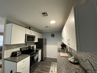 Beautifully Updated Greenbriar Model features 2 Bedrooms, 1 Full on Leisure Village Golf Course in New York - for sale on GolfHomes.com, golf home, golf lot