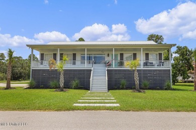 Welcome to 129 Sweet Bay Dr., a stunning coastal retreat nestled on Pass Christian Isles Golf Club in Mississippi - for sale on GolfHomes.com, golf home, golf lot