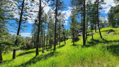 The best drive in town is through a park of ridge top views on Eagle Bend Golf Course in Montana - for sale on GolfHomes.com, golf home, golf lot