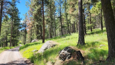 The best drive in town is through a park of ridge top views on Eagle Bend Golf Course in Montana - for sale on GolfHomes.com, golf home, golf lot