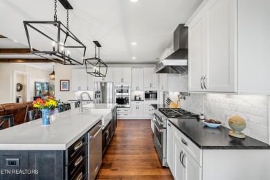 Step into a residence where sophistication meets serenity. This on Rarity Bay Country Club - Loudon in Tennessee - for sale on GolfHomes.com, golf home, golf lot