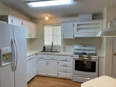 You won't find a better-maintained home than this beautifully on Lakes at Leesburg Golf Course in Florida - for sale on GolfHomes.com, golf home, golf lot