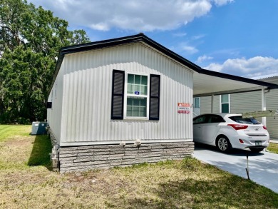 Welcome home to this 1994 single wide manufactured home, which on Golden Lakes Golf Course in Florida - for sale on GolfHomes.com, golf home, golf lot