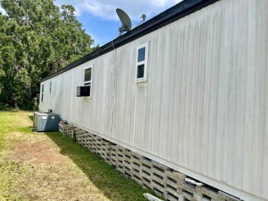 Welcome home to this 1994 single wide manufactured home, which on Golden Lakes Golf Course in Florida - for sale on GolfHomes.com, golf home, golf lot