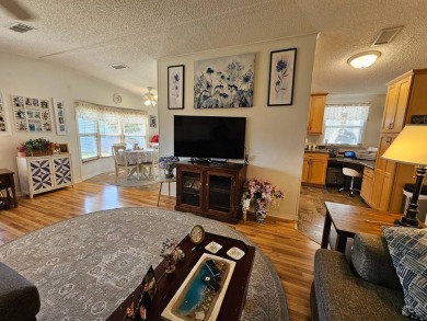 This lovely home is located in North Fort Myers Florida! Pine on Pine Lakes Country Club in Florida - for sale on GolfHomes.com, golf home, golf lot