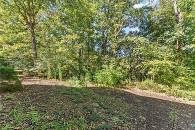 Beautifully situated on a private golf course lot, this stunning on Trophy Club of Apalachee in Georgia - for sale on GolfHomes.com, golf home, golf lot