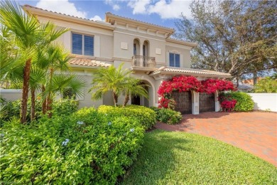 This magnificent two-story courtyard style home features 4BR, 4 on Pelican Marsh Golf Club in Florida - for sale on GolfHomes.com, golf home, golf lot