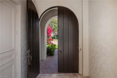 This magnificent two-story courtyard style home features 4BR, 4 on Pelican Marsh Golf Club in Florida - for sale on GolfHomes.com, golf home, golf lot