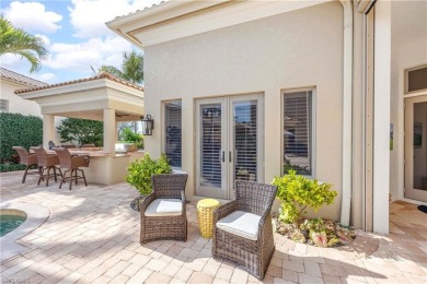 This magnificent two-story courtyard style home features 4BR, 4 on Pelican Marsh Golf Club in Florida - for sale on GolfHomes.com, golf home, golf lot