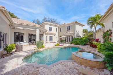 This magnificent two-story courtyard style home features 4BR, 4 on Pelican Marsh Golf Club in Florida - for sale on GolfHomes.com, golf home, golf lot