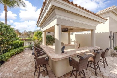 This magnificent two-story courtyard style home features 4BR, 4 on Pelican Marsh Golf Club in Florida - for sale on GolfHomes.com, golf home, golf lot