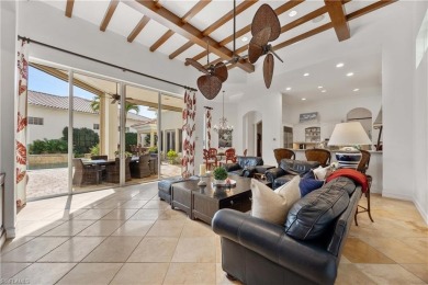 This magnificent two-story courtyard style home features 4BR, 4 on Pelican Marsh Golf Club in Florida - for sale on GolfHomes.com, golf home, golf lot