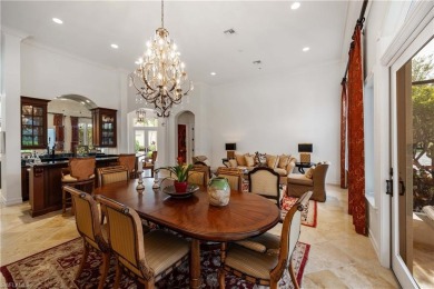 This magnificent two-story courtyard style home features 4BR, 4 on Pelican Marsh Golf Club in Florida - for sale on GolfHomes.com, golf home, golf lot