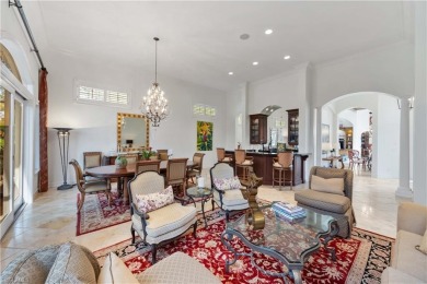 This magnificent two-story courtyard style home features 4BR, 4 on Pelican Marsh Golf Club in Florida - for sale on GolfHomes.com, golf home, golf lot