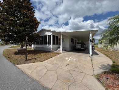 Centrally located, welcome to your new home in beautiful Winter on Lake Henry Golf Club in Florida - for sale on GolfHomes.com, golf home, golf lot