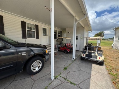 Centrally located, welcome to your new home in beautiful Winter on Lake Henry Golf Club in Florida - for sale on GolfHomes.com, golf home, golf lot