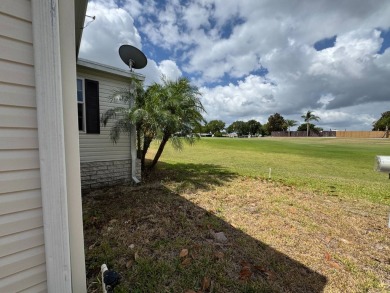 Centrally located, welcome to your new home in beautiful Winter on Lake Henry Golf Club in Florida - for sale on GolfHomes.com, golf home, golf lot