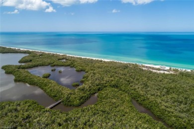 This Tuscany inspired 3-bedroom, 3-bath luxury tower residence on Club at Pelican Bay Golf Course in Florida - for sale on GolfHomes.com, golf home, golf lot