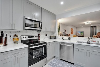 Remarkable + renovated townhouse condo nestled in the heart of on Palm-Aire Country Club and Resort - Palms in Florida - for sale on GolfHomes.com, golf home, golf lot