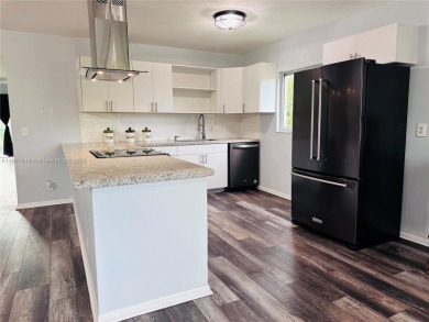 Bright and spacious corner unit in the desirable Century Village on Flamingo Lakes Country Club in Florida - for sale on GolfHomes.com, golf home, golf lot