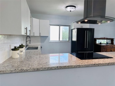 Bright and spacious corner unit in the desirable Century Village on Flamingo Lakes Country Club in Florida - for sale on GolfHomes.com, golf home, golf lot