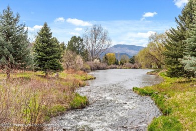 A beautiful corner lot location on a stream in the one-of-a-kind on Ranch at Roaring Fork Golf Course in Colorado - for sale on GolfHomes.com, golf home, golf lot