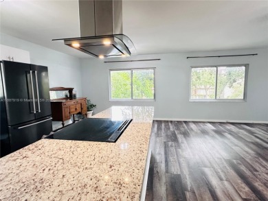 Bright and spacious corner unit in the desirable Century Village on Flamingo Lakes Country Club in Florida - for sale on GolfHomes.com, golf home, golf lot