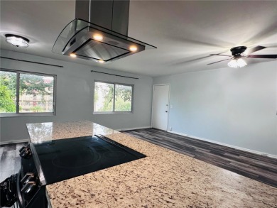 Bright and spacious corner unit in the desirable Century Village on Flamingo Lakes Country Club in Florida - for sale on GolfHomes.com, golf home, golf lot