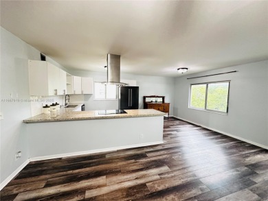 Bright and spacious corner unit in the desirable Century Village on Flamingo Lakes Country Club in Florida - for sale on GolfHomes.com, golf home, golf lot