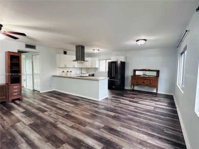 Bright and spacious corner unit in the desirable Century Village on Flamingo Lakes Country Club in Florida - for sale on GolfHomes.com, golf home, golf lot